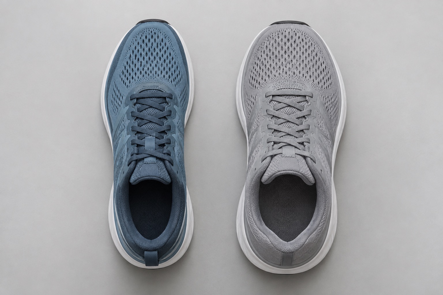Top-down comparison of a running shoe with a broad toe shape and a running shoe with greater width through more of the upper